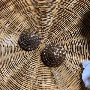 Vintage set of 2 circular orange/gold rhinestone brooches